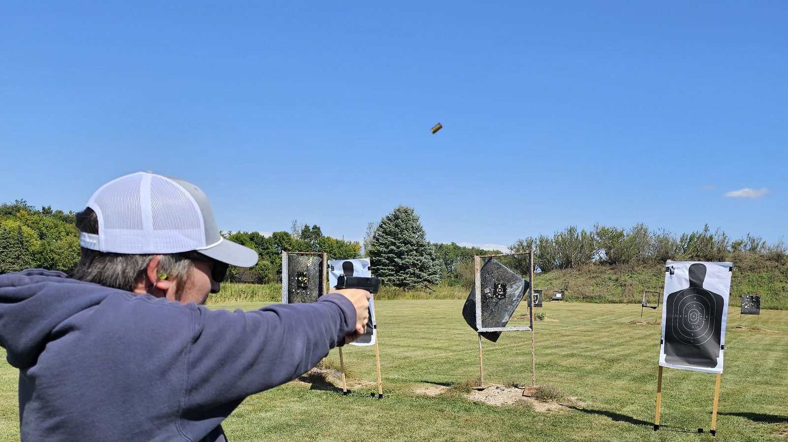 Student firing on the outdoor range during a permit to carry session.