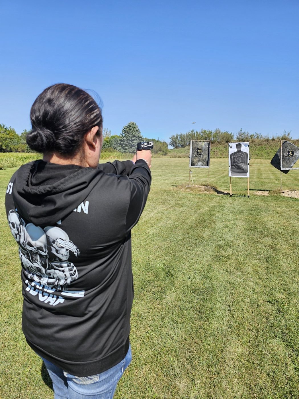 Instructor coaching a student on the firing line